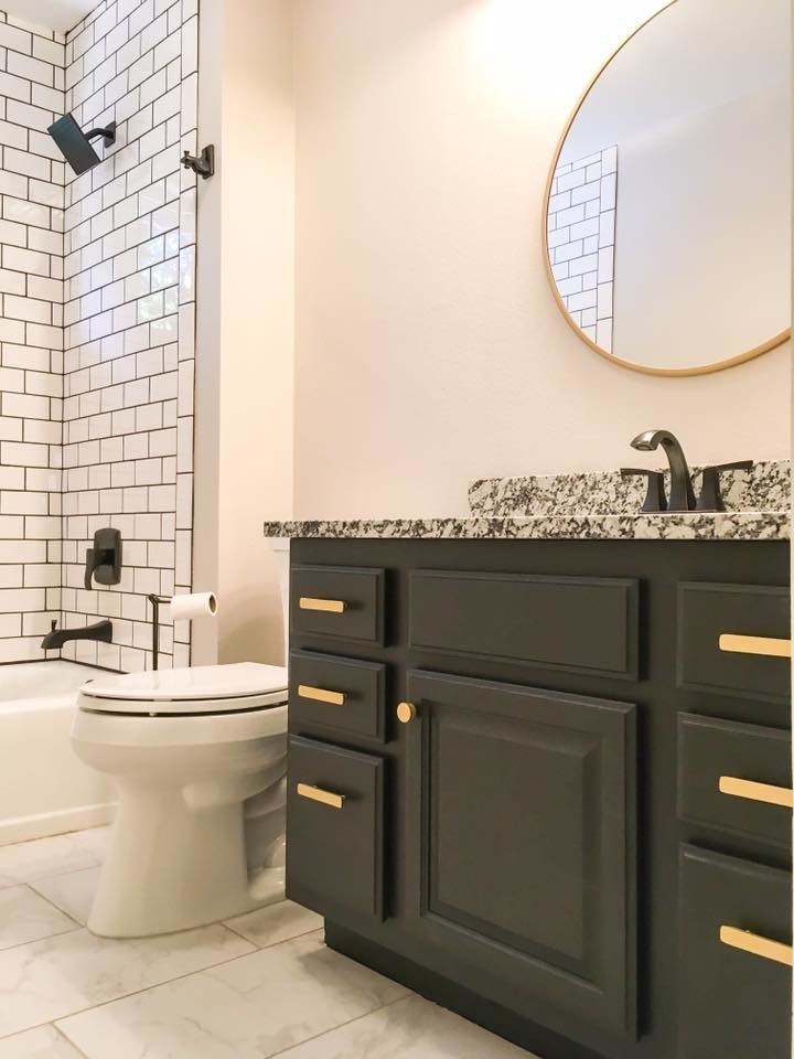 Traditional bathroom in Kansas City with flat-panel cabinets, brown cabinets, a shower/bath combination, a one-piece toilet, white tiles, metro tiles, beige walls, porcelain flooring, a submerged sink, granite worktops, white floors and a shower curtain.