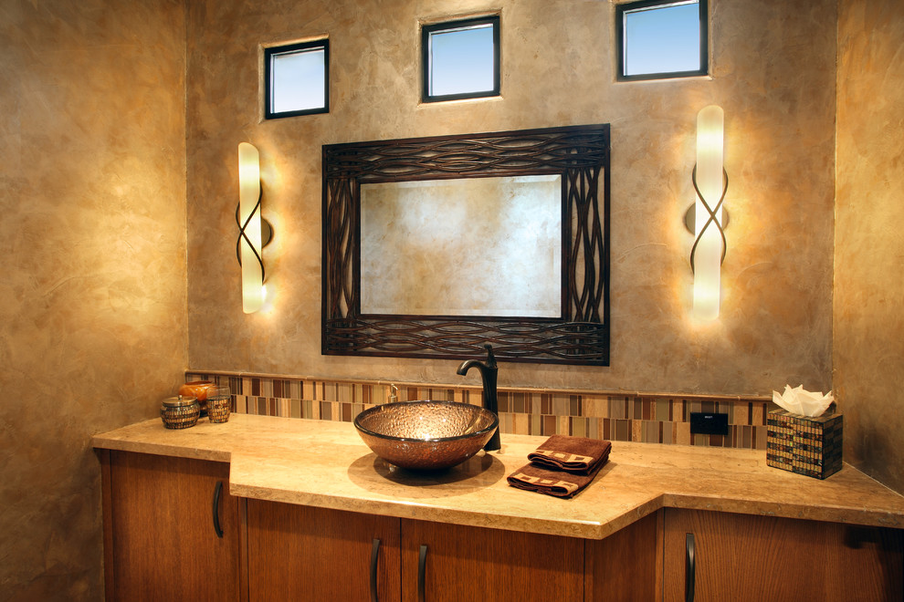 Large trendy 3/4 multicolored tile and glass tile travertine floor bathroom photo in Phoenix with flat-panel cabinets, medium tone wood cabinets, a one-piece toilet, beige walls and limestone countertops