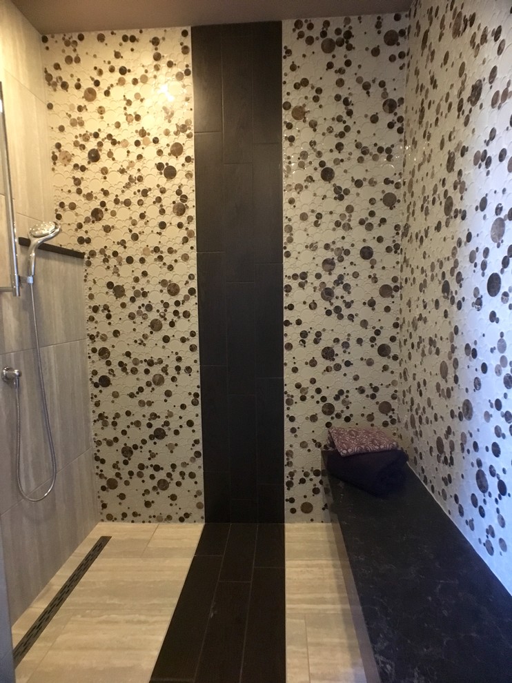 Example of a large trendy master black and white tile, brown tile and ceramic tile porcelain tile alcove shower design in Milwaukee with beige walls