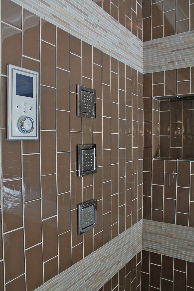 Example of a large trendy gray tile porcelain tile bathroom design in Dallas with a drop-in sink, flat-panel cabinets, dark wood cabinets, quartz countertops, a one-piece toilet and gray walls