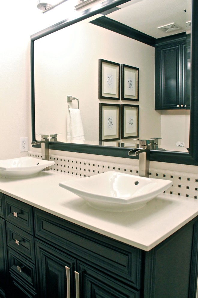 Small elegant white tile and ceramic tile porcelain tile bathroom photo in Dallas with a vessel sink, raised-panel cabinets, black cabinets, quartz countertops, a one-piece toilet and beige walls