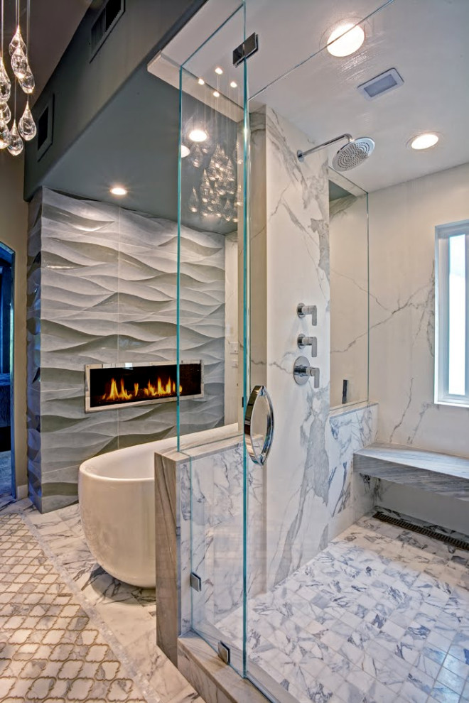 Inspiration for an expansive contemporary ensuite bathroom in San Francisco with a freestanding bath, grey walls, marble worktops, a hinged door, an alcove shower, grey tiles, grey floors and a chimney breast.