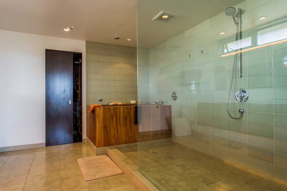 Example of a large trendy master green tile and porcelain tile dark wood floor bathroom design in Los Angeles with flat-panel cabinets, dark wood cabinets, a one-piece toilet, white walls, a drop-in sink and wood countertops