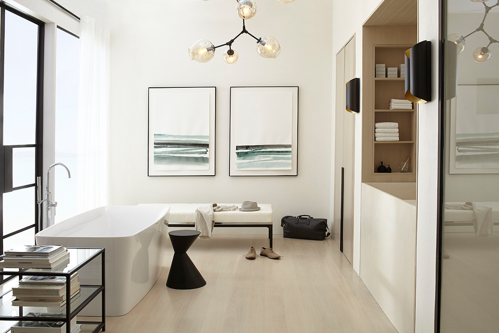 Bathroom - mid-sized contemporary master light wood floor bathroom idea in Miami with flat-panel cabinets, light wood cabinets, a bidet, white walls, an integrated sink and concrete countertops