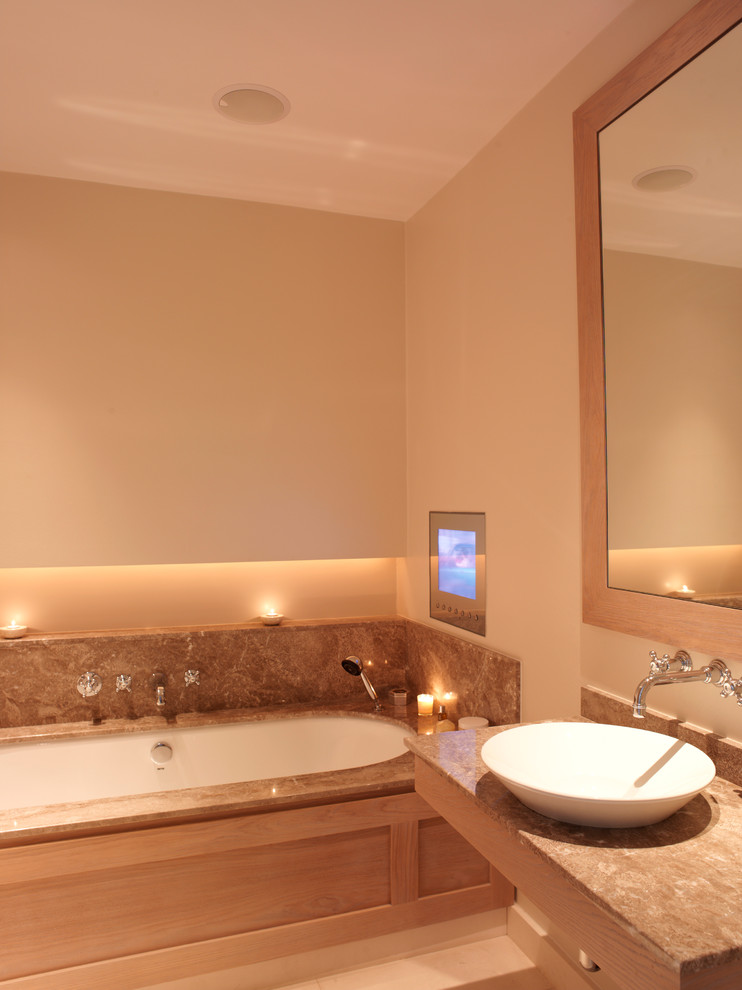 Bathroom - contemporary bathroom idea in London with granite countertops and a vessel sink