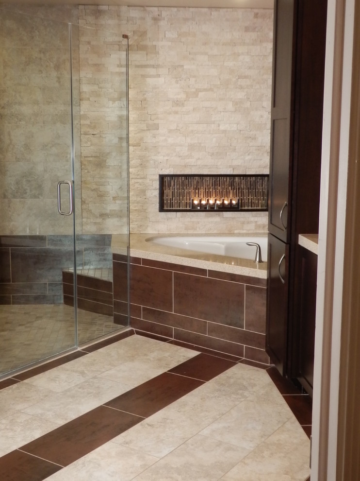 Mid-sized trendy master beige tile and porcelain tile porcelain tile corner shower photo in Phoenix with an undermount sink, shaker cabinets, dark wood cabinets, quartz countertops, an undermount tub, a one-piece toilet and orange walls