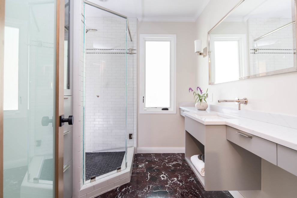 Inspiration for a transitional 3/4 white tile and ceramic tile marble floor bathroom remodel in Los Angeles with flat-panel cabinets, gray cabinets, an undermount sink, quartz countertops and white countertops