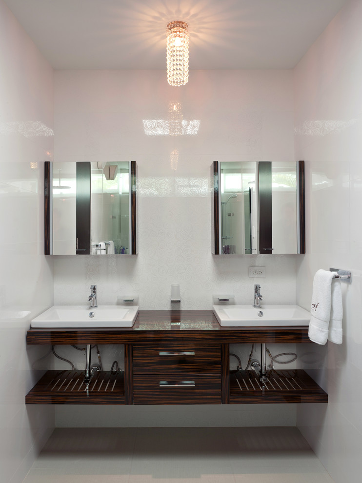 Example of a large trendy kids' white tile and ceramic tile ceramic tile alcove shower design in Other with open cabinets, dark wood cabinets, wood countertops, a two-piece toilet, a drop-in sink and white walls