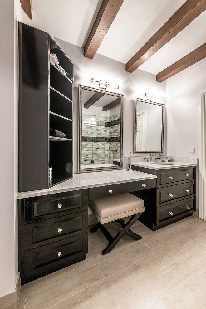 Inspiration for a medium sized rustic ensuite bathroom in Miami with raised-panel cabinets, dark wood cabinets, a built-in bath, an alcove shower, a two-piece toilet, metro tiles, grey walls, porcelain flooring, a submerged sink and engineered stone worktops.