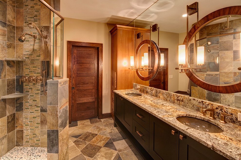 Mid-sized mountain style master green tile and stone tile slate floor bathroom photo in New York with an undermount sink, flat-panel cabinets, dark wood cabinets, granite countertops and beige walls