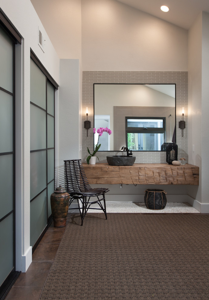 Bathroom - asian master bathroom idea in Orange County with wood countertops