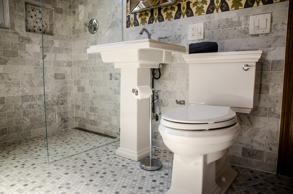 Medium sized victorian bathroom in Chicago with a built-in shower, a two-piece toilet, grey tiles, metro tiles, multi-coloured walls, marble flooring and a pedestal sink.