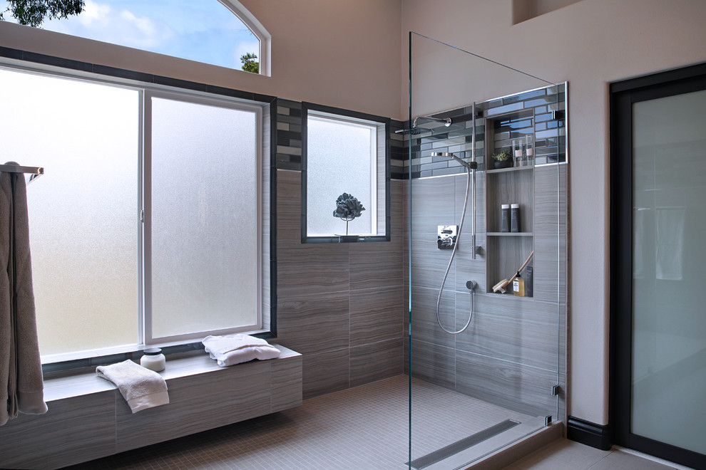 Inspiration for a medium sized contemporary ensuite bathroom in Orange County with flat-panel cabinets, grey cabinets, a walk-in shower, grey tiles, porcelain tiles, grey walls, porcelain flooring, a submerged sink and engineered stone worktops.
