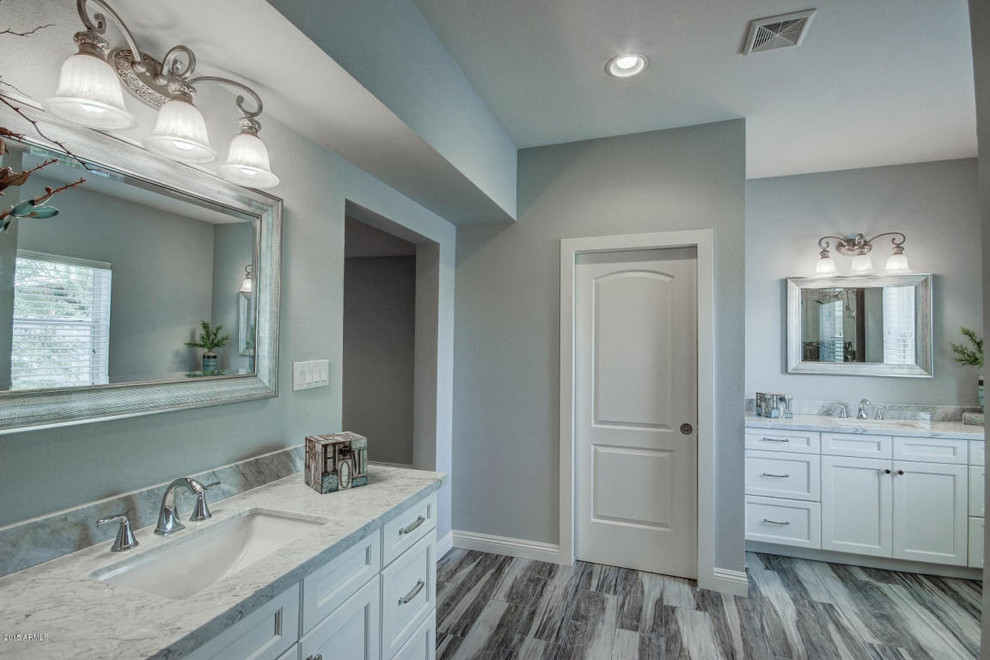 Bathroom - large contemporary master porcelain tile bathroom idea in Phoenix with an undermount sink, recessed-panel cabinets, white cabinets, quartz countertops and gray walls