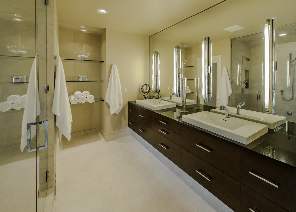 This is an example of a contemporary ensuite bathroom in Portland with dark wood cabinets.