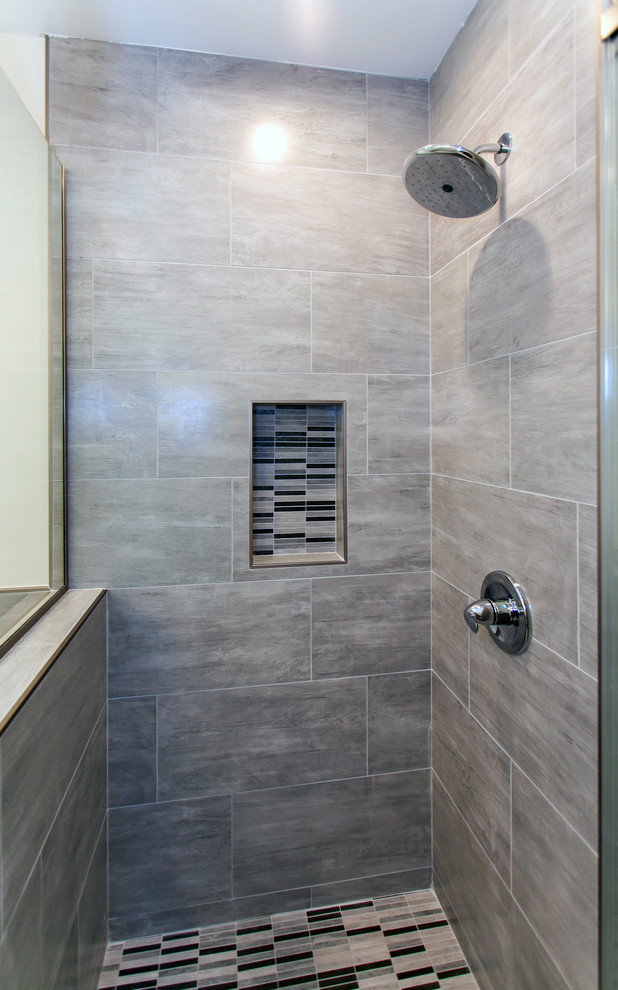 Corner shower - mid-sized contemporary master gray tile and porcelain tile porcelain tile corner shower idea in Los Angeles with furniture-like cabinets, white cabinets, an undermount tub, a one-piece toilet, white walls, an undermount sink and marble countertops