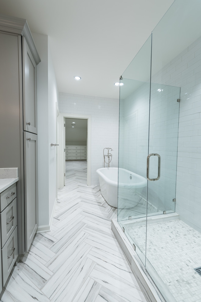 Design ideas for a medium sized contemporary ensuite bathroom in Other with recessed-panel cabinets, grey cabinets, an alcove shower, white tiles, white walls, ceramic flooring, an integrated sink, marble worktops, white floors and a sliding door.