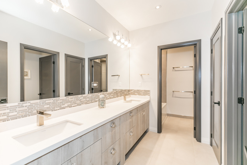 Photo of a medium sized modern bathroom in Other with shaker cabinets, white cabinets, an alcove shower, a one-piece toilet, multi-coloured tiles, metro tiles, white walls, a submerged sink, beige floors, a hinged door and white worktops.