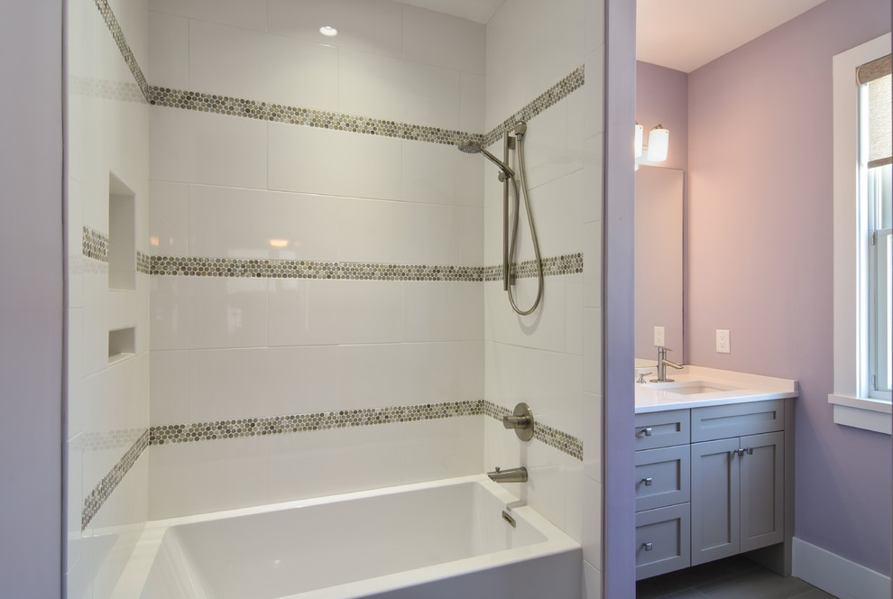 Medium sized classic shower room bathroom in Charleston with shaker cabinets, grey cabinets, an alcove bath, a shower/bath combination, white tiles, porcelain tiles, purple walls, a submerged sink, engineered stone worktops and white worktops.