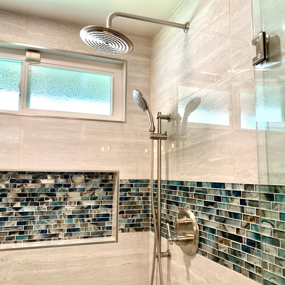Example of a large beach style master gray tile and porcelain tile vinyl floor, gray floor, double-sink and vaulted ceiling bathroom design in Los Angeles with shaker cabinets, dark wood cabinets, a one-piece toilet, green walls, an undermount sink, quartz countertops, a hinged shower door, white countertops and a built-in vanity