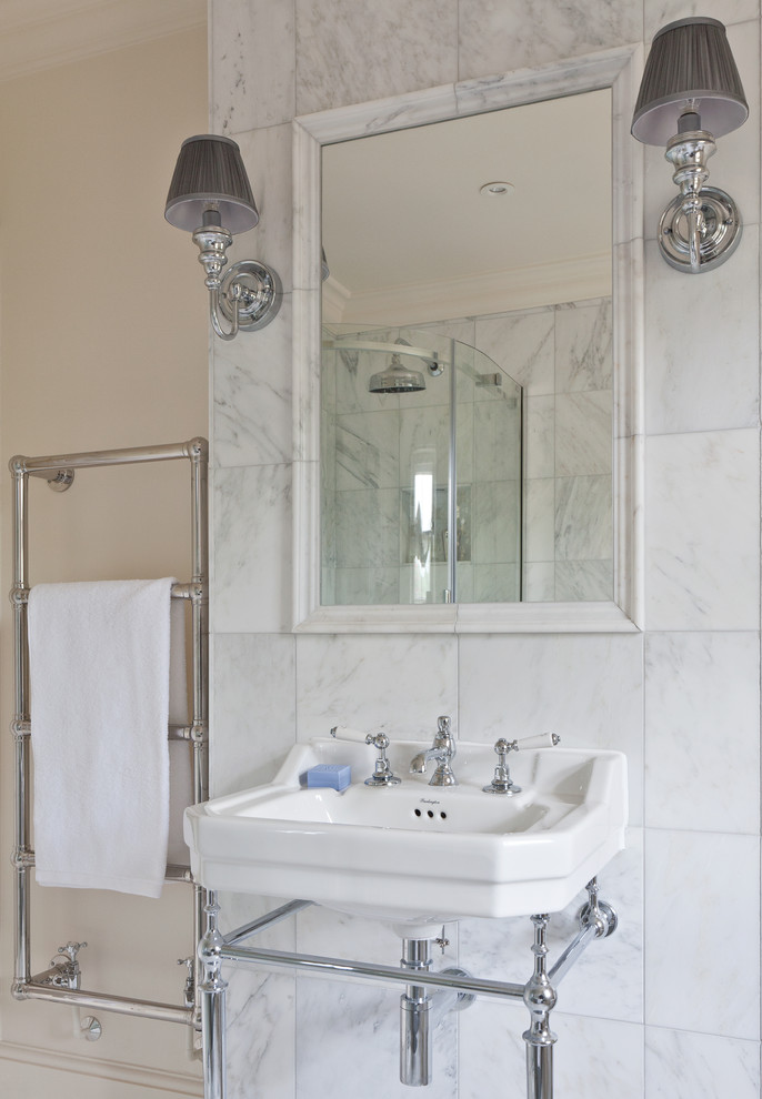 Medium sized traditional family bathroom in Sussex with recessed-panel cabinets, white cabinets, a freestanding bath, a corner shower, a two-piece toilet, white tiles, stone slabs, white walls and marble flooring.
