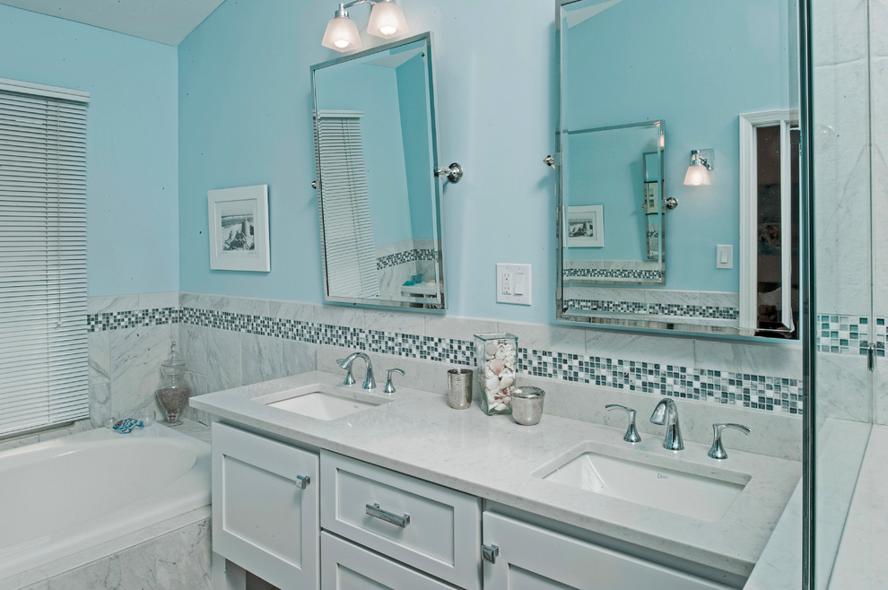 Example of a mid-sized eclectic master white tile and porcelain tile porcelain tile bathroom design in Philadelphia with an undermount sink, shaker cabinets, white cabinets, quartz countertops, a one-piece toilet and blue walls