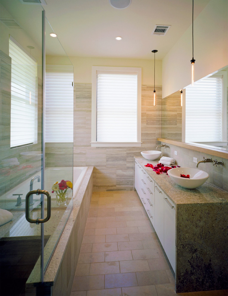 Example of a trendy bathroom design in Austin with granite countertops and a vessel sink