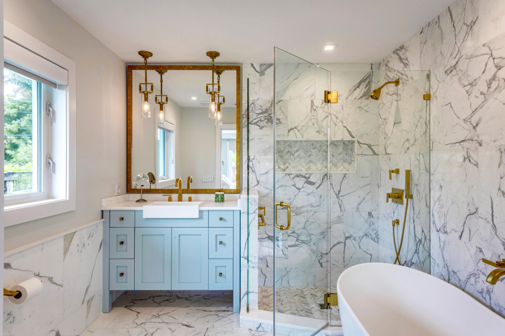 Bathroom - transitional white tile gray floor and single-sink bathroom idea in Miami with shaker cabinets, blue cabinets, gray walls, a drop-in sink, a hinged shower door, white countertops and a built-in vanity