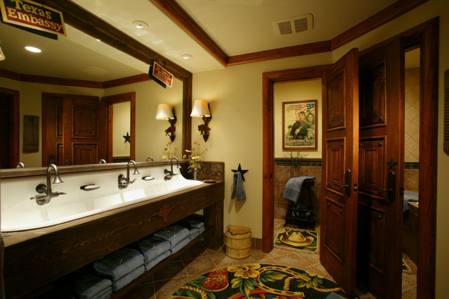 Expansive rustic ensuite bathroom in Denver with open cabinets, dark wood cabinets, grey tiles, ceramic tiles, beige walls, ceramic flooring, a trough sink, wooden worktops and beige floors.
