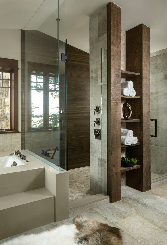 Inspiration for a rustic ensuite bathroom in Other with dark wood cabinets, a submerged bath, a built-in shower, grey tiles, grey floors and a hinged door.