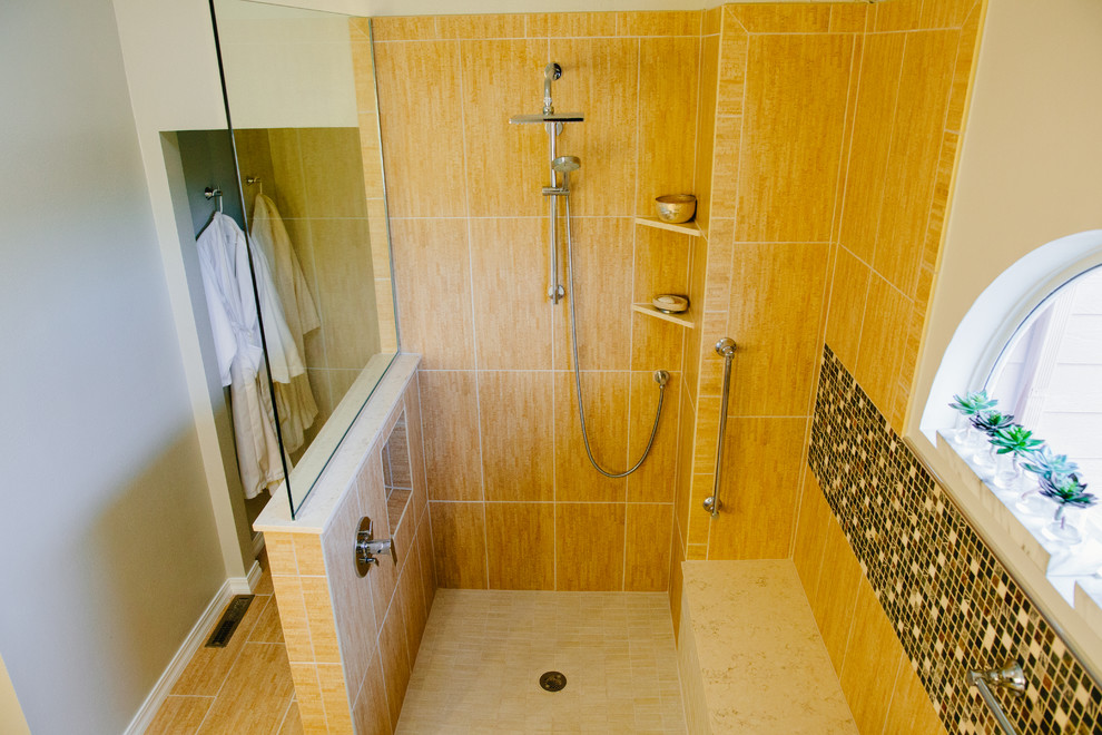 Example of a mid-sized zen master beige tile and porcelain tile porcelain tile bathroom design in Denver with flat-panel cabinets, medium tone wood cabinets, a two-piece toilet, white walls, an undermount sink and quartz countertops