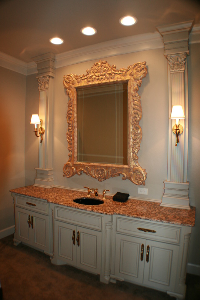 Bathroom - traditional bathroom idea in New Orleans with furniture-like cabinets, an undermount sink and granite countertops