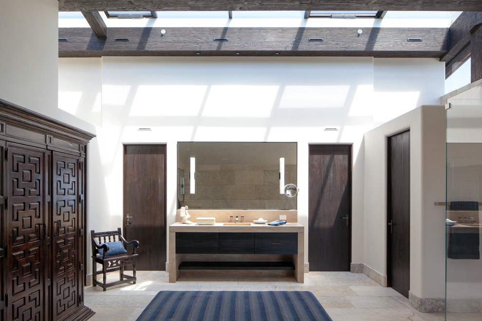 Inspiration for a mediterranean limestone floor bathroom remodel in Orange County