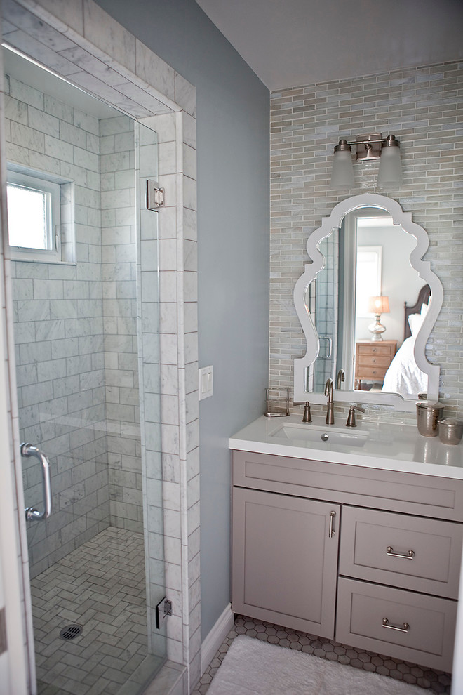 Inspiration for a small coastal master white tile and mosaic tile marble floor corner shower remodel in San Diego with a drop-in sink, shaker cabinets, gray cabinets, quartz countertops, a one-piece toilet and blue walls