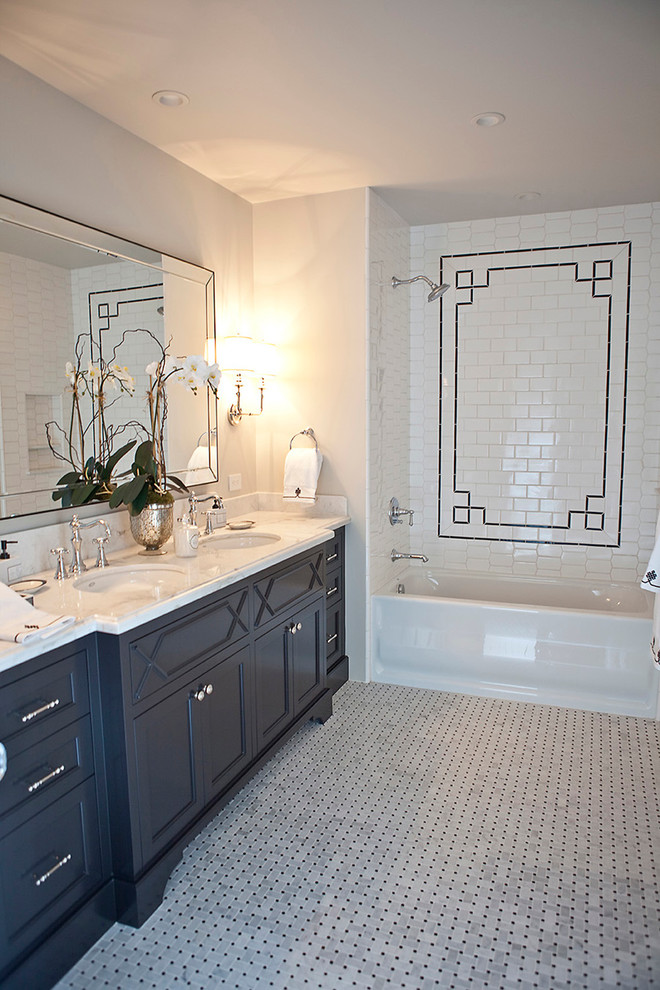 Large transitional master white tile and mosaic tile mosaic tile floor bathroom photo in San Diego with furniture-like cabinets, black cabinets, beige walls, an undermount sink and marble countertops