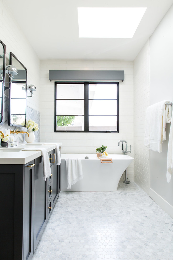 Inspiration for a large country master gray tile and ceramic tile white floor bathroom remodel in Los Angeles with recessed-panel cabinets, gray cabinets and white walls