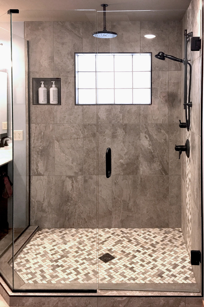 Inspiration for a small transitional master beige tile and mosaic tile ceramic tile corner shower remodel in Other with furniture-like cabinets, brown cabinets, a one-piece toilet, blue walls, an undermount sink and granite countertops