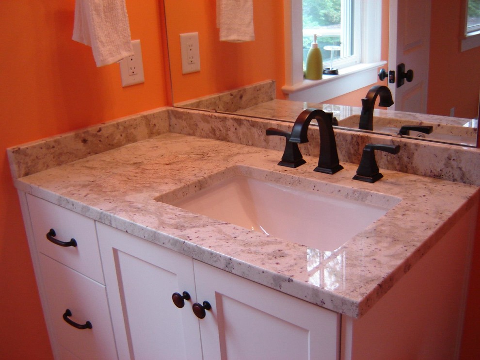 Medium sized classic bathroom in Charlotte with recessed-panel cabinets, white cabinets, granite worktops and orange walls.
