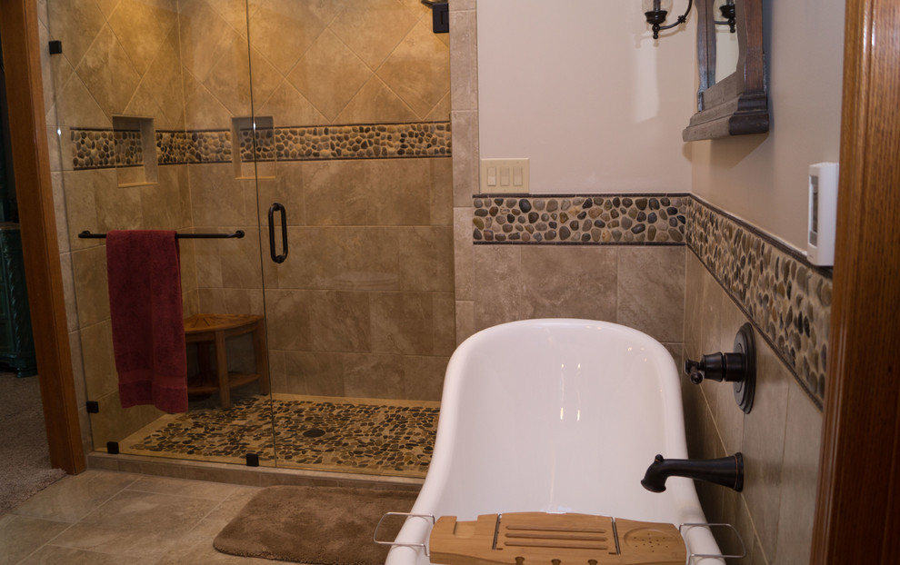 Example of a large southwest master multicolored tile and ceramic tile ceramic tile bathroom design in Other with raised-panel cabinets, medium tone wood cabinets, a two-piece toilet, beige walls, an undermount sink and concrete countertops