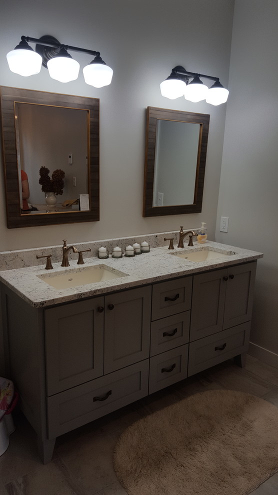 Example of a mid-sized cottage chic master vinyl floor and gray floor bathroom design in Minneapolis with flat-panel cabinets, gray cabinets, gray walls, an undermount sink, granite countertops and white countertops