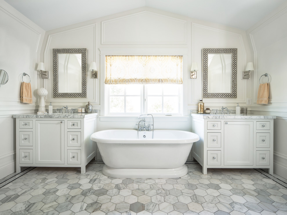 Example of a classic master freestanding bathtub design in Salt Lake City with shaker cabinets, white cabinets and white walls