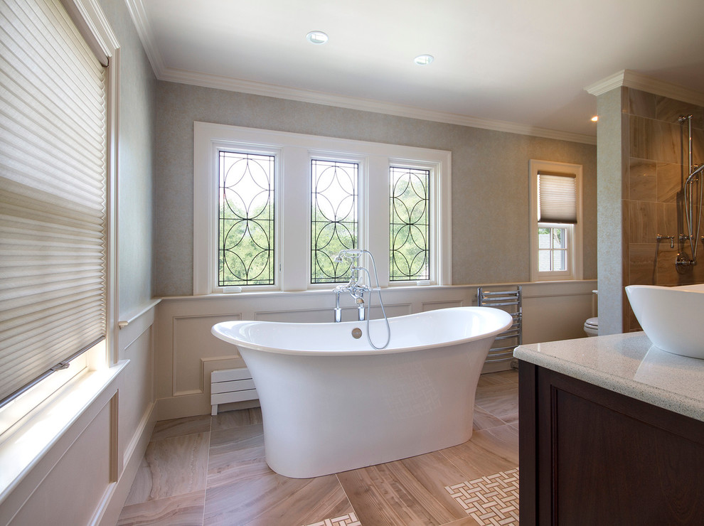 Medium sized classic ensuite bathroom in Boston with freestanding cabinets, dark wood cabinets, engineered stone worktops, a freestanding bath, beige tiles and porcelain tiles.