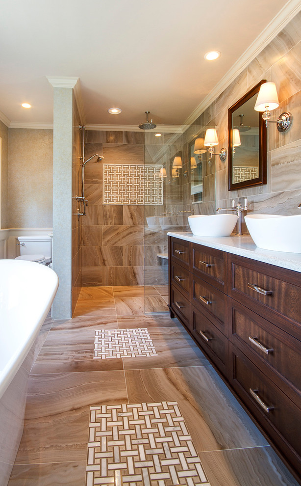 Bathroom - mid-sized transitional master beige tile and porcelain tile porcelain tile bathroom idea in Boston with a vessel sink, furniture-like cabinets, dark wood cabinets, quartz countertops, a one-piece toilet and beige walls