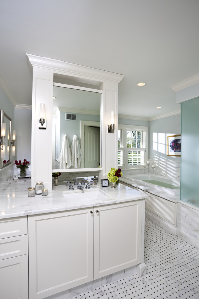 Design ideas for a large traditional ensuite bathroom in Minneapolis with shaker cabinets, white cabinets, a built-in bath, a corner shower, grey tiles, white tiles, stone slabs, blue walls, mosaic tile flooring, a submerged sink, marble worktops, multi-coloured floors and a hinged door.