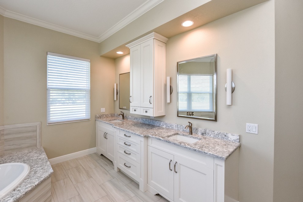 Large transitional master multicolored tile and porcelain tile porcelain tile bathroom photo in Tampa with shaker cabinets, white cabinets, beige walls, an undermount sink and quartz countertops