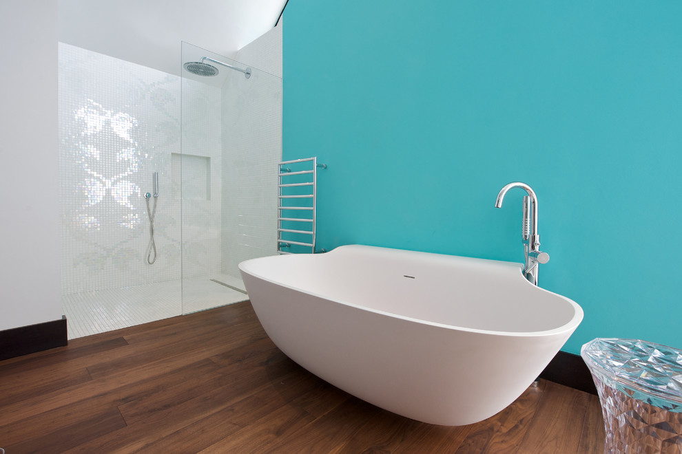 Example of a trendy mosaic tile and white tile vinyl floor and brown floor bathroom design in Other with blue walls