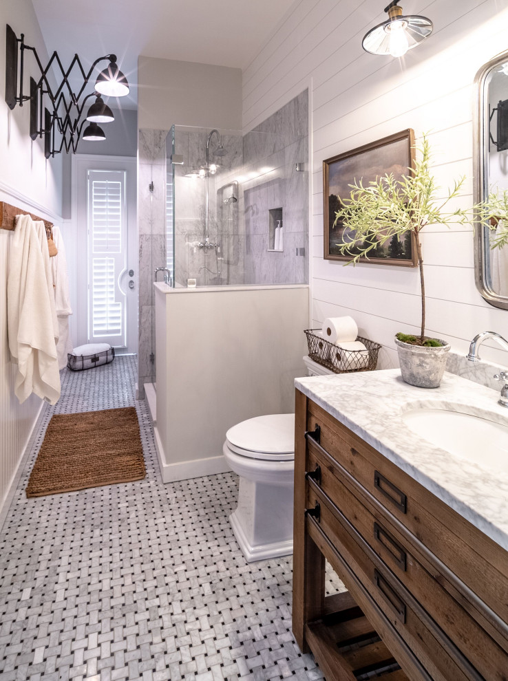Example of a small urban 3/4 gray tile and marble tile marble floor and gray floor doorless shower design in Miami with furniture-like cabinets, medium tone wood cabinets, marble countertops, a hinged shower door and gray countertops