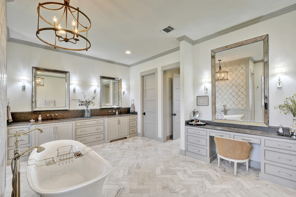 Пример оригинального дизайна: ванная комната в стиле кантри с серыми фасадами, отдельно стоящей ванной, белыми стенами, душевой кабиной, врезной раковиной, белым полом и серой столешницей