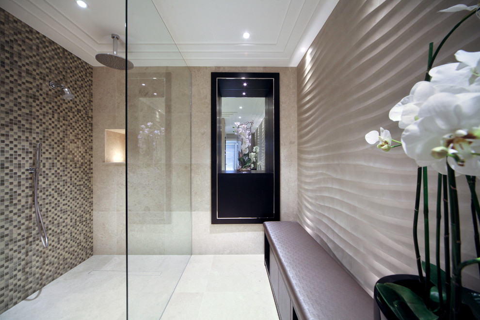 This is an example of a large contemporary family bathroom in Kent with freestanding cabinets, a walk-in shower, beige tiles, beige walls, marble flooring and marble worktops.
