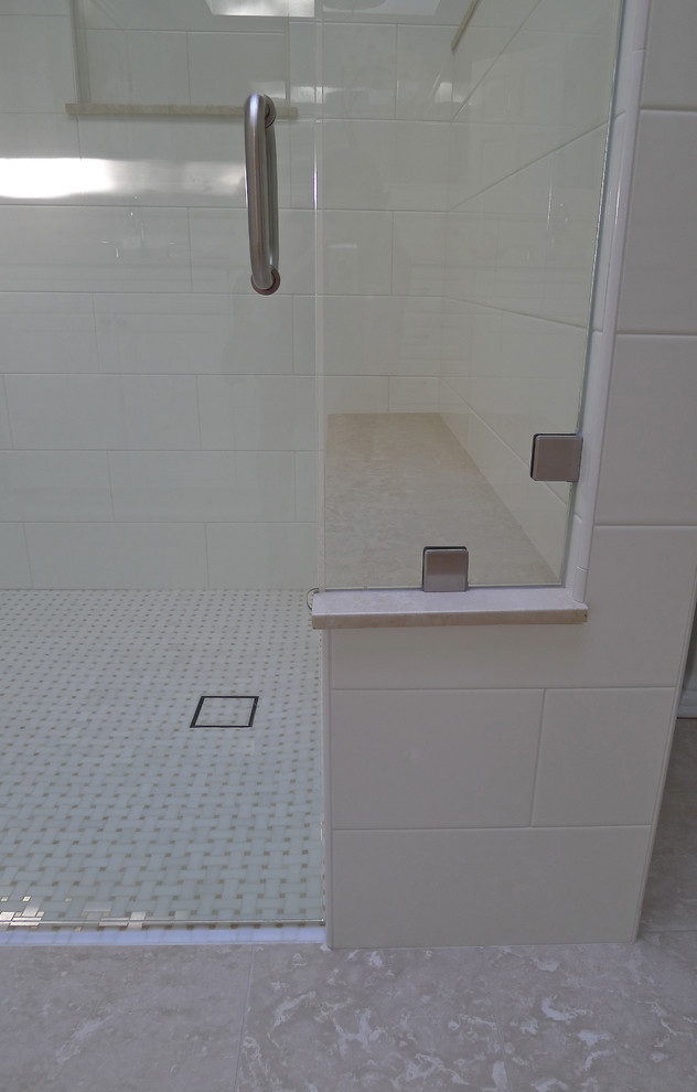 Mid-sized elegant white tile and ceramic tile marble floor walk-in shower photo in Seattle with an undermount sink, a two-piece toilet, recessed-panel cabinets, white cabinets, marble countertops and blue walls